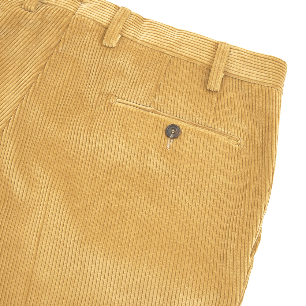 The Manson Sunflower Yellow Corduroy Trousers by Turnbull & Asser feature a straight-leg fit, belt loops, side pockets, and button closure—ideal for refreshing your seasonal wardrobe. Displayed against a plain white background.