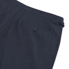 View 2 of product Harry Navy Check Wool Trousers by Turnbull & Asser feature a slim fit, angled side adjusters, and pressed leg creases, displayed on a plain white background.
