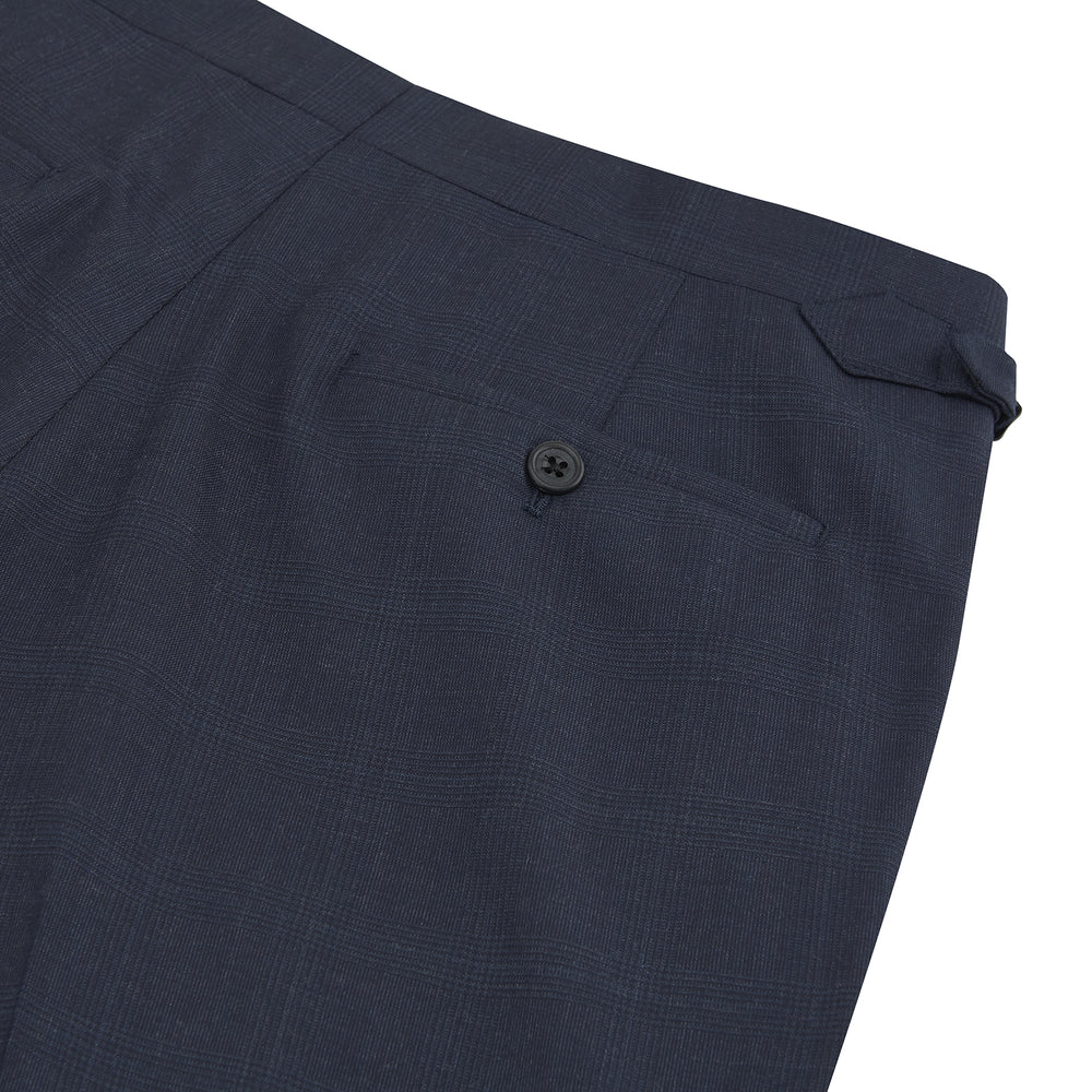 Harry Navy Check Wool Trousers by Turnbull & Asser feature a slim fit, angled side adjusters, and pressed leg creases, displayed on a plain white background.