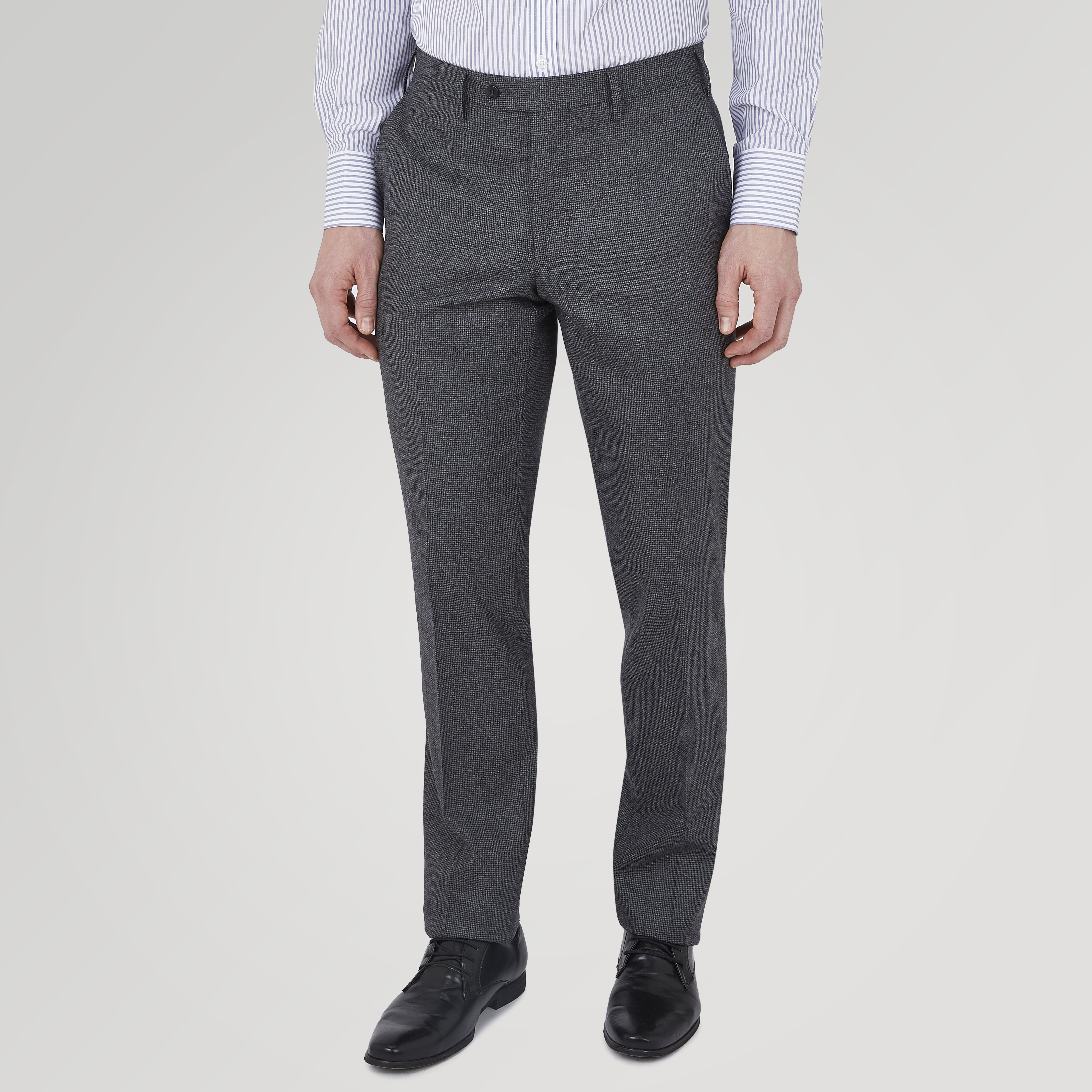 View 2 of product The Turnbull & Asser Jackson Grey Flannel Wool Trousers feature a tailored fit with button and zipper closure, crafted from premium wool flannel for a refined look, shown against a plain white background.