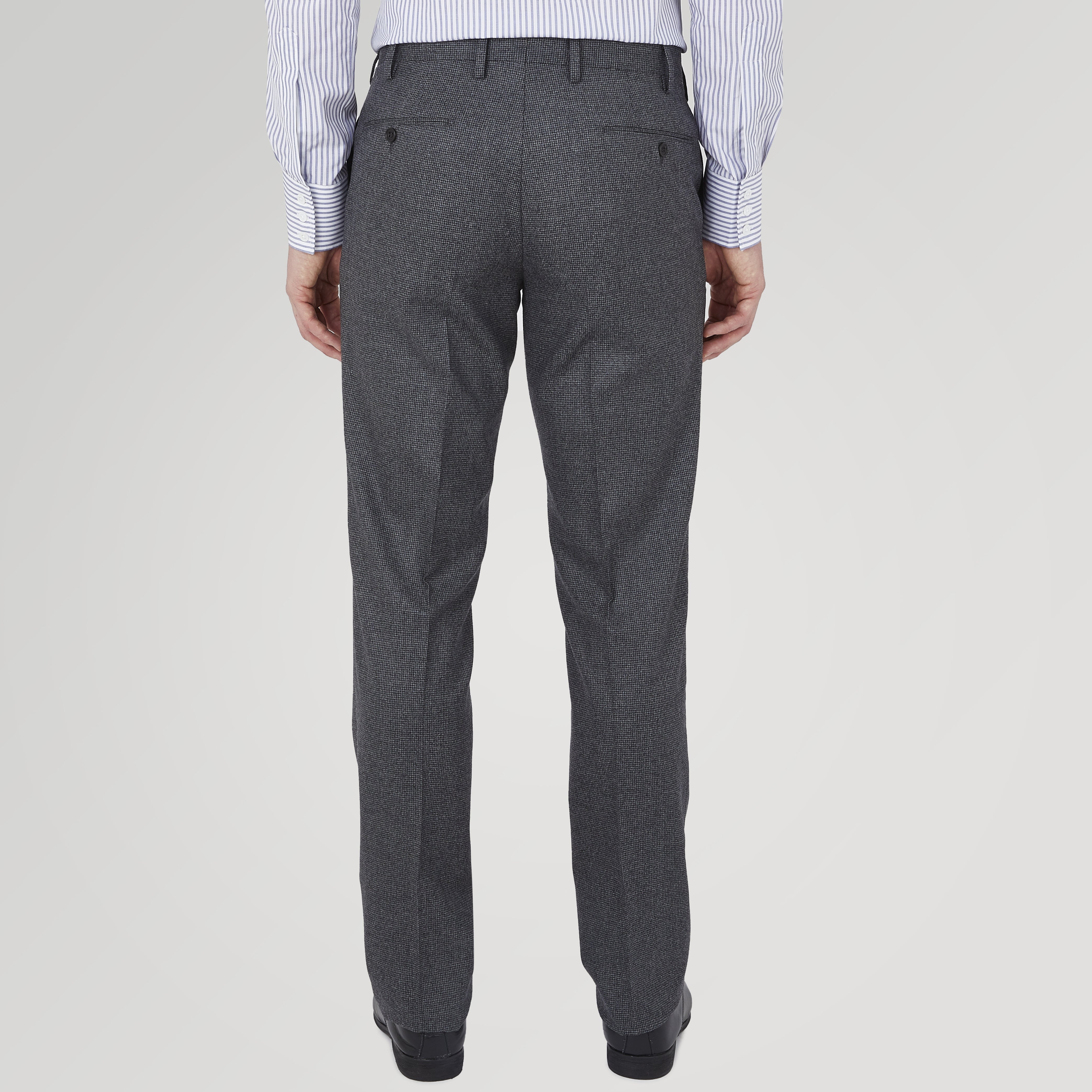 View 3 of product The Turnbull & Asser Jackson Grey Flannel Wool Trousers feature a tailored fit with button and zipper closure, crafted from premium wool flannel for a refined look, shown against a plain white background.