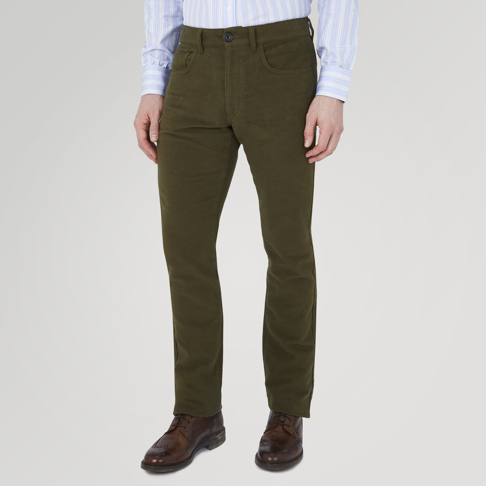 The Hanley Dark Olive Moleskin 5-Pocket Trousers by Turnbull & Asser are slim-fit casual trousers with front and back pockets, button closure, and belt loops, shown flat on a white background.
