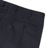 View 2 of product Turnbull & Asser Navy Worsted Wool Pleated Formal Trousers feature a straight leg, front zipper, and button closure, shown against a plain white background.