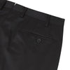 View 2 of product The Turnbull & Asser Brown Worsted Wool Pleated Formal Trousers feature belt loops, side pockets, and a button closure, crafted from fine wool and shown against a plain white background.