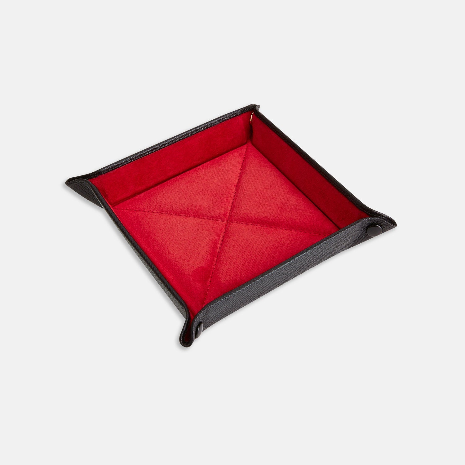 View 1 of product The Turnbull & Asser Black and Red Square Leather Travel Tray features a black exterior, red suede interior, raised edges, and snapped corners—an essential for organizing small accessories. Shown on a white background.
