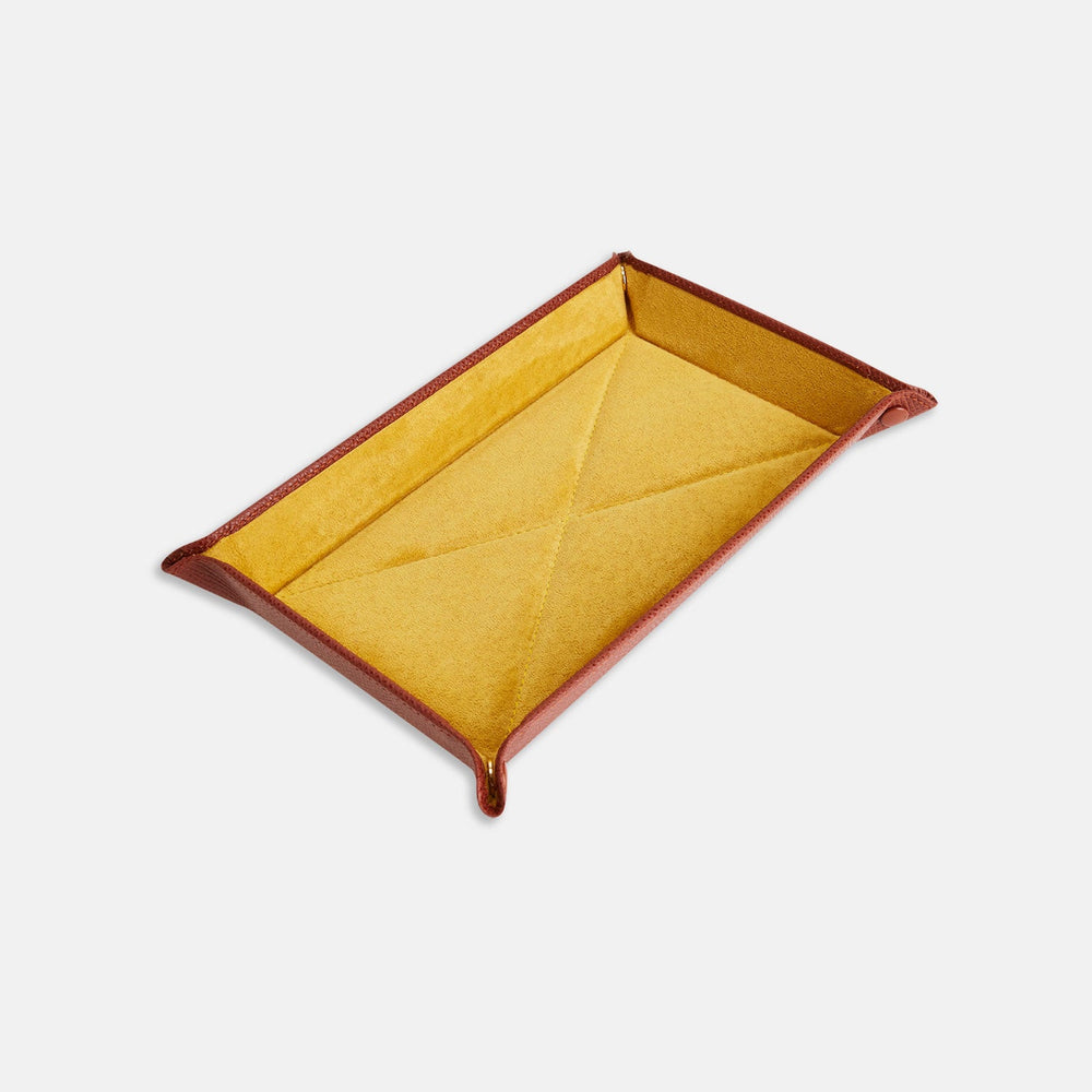 The Turnbull & Asser Brown and Yellow Rectangular Leather Travel Tray keeps small accessories organized—an essential packing item with raised edges, brown exterior, and yellow interior—shown on a white background.