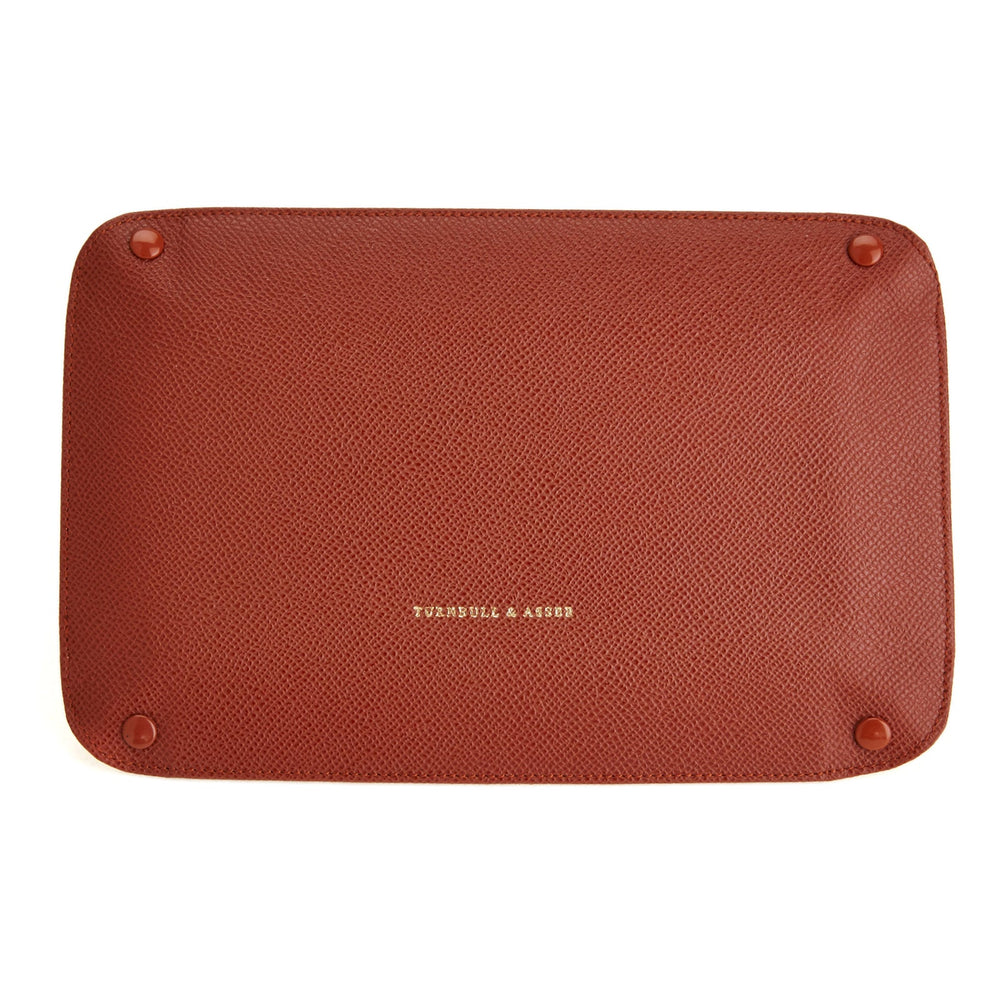 The Turnbull & Asser Brown and Yellow Rectangular Leather Travel Tray keeps small accessories organized—an essential packing item with raised edges, brown exterior, and yellow interior—shown on a white background.