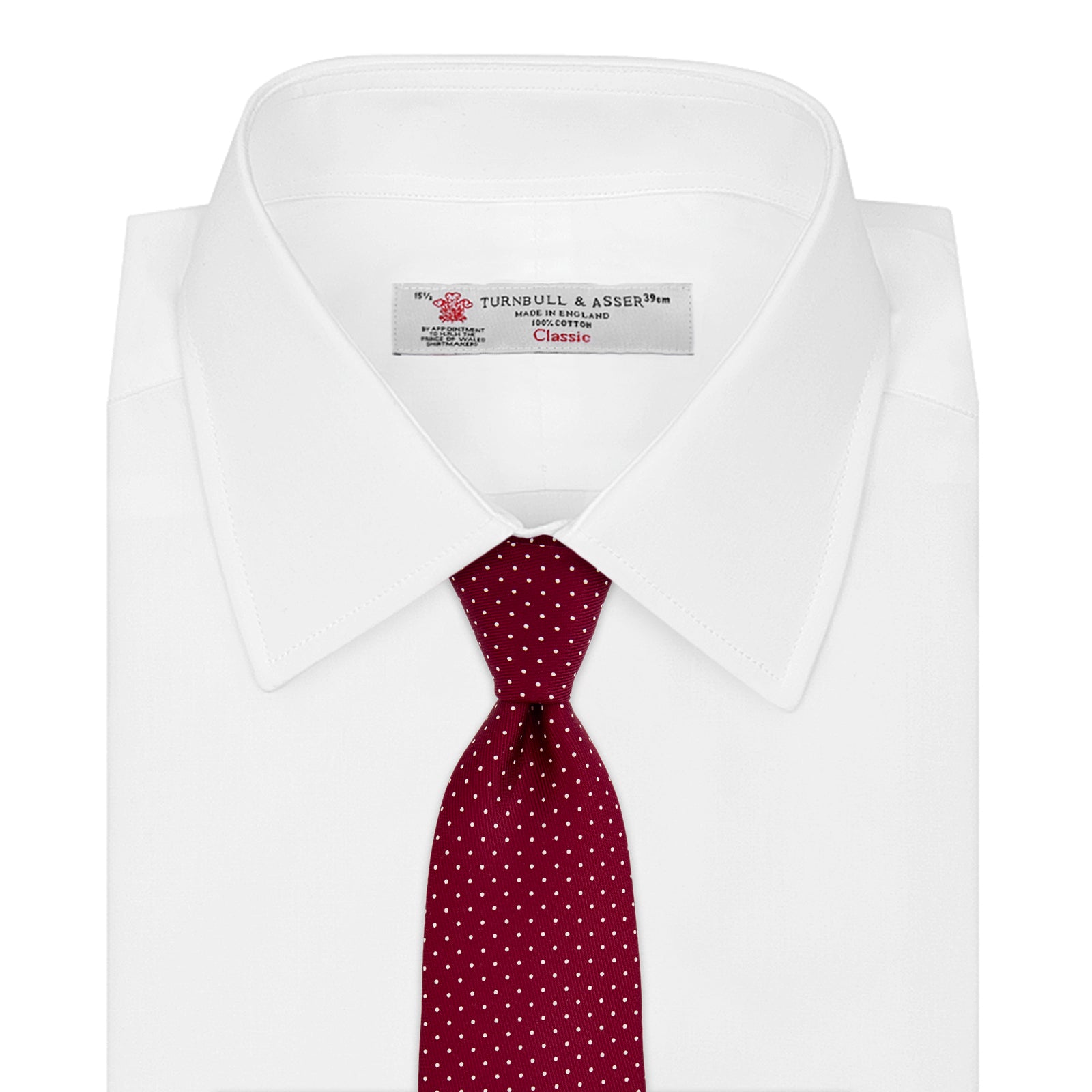View 2 of product The Turnbull & Asser Burgundy and White Small Spot Printed Silk Tie, shown rolled against a plain white background, is an elegant accessory ideal for the office.