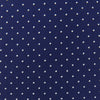 View 3 of product The Blue and White Small Spot Printed Silk Tie by Turnbull & Asser, shown rolled on a white background, features a refined white polka dot pattern—ideal for complementing any office shirt.