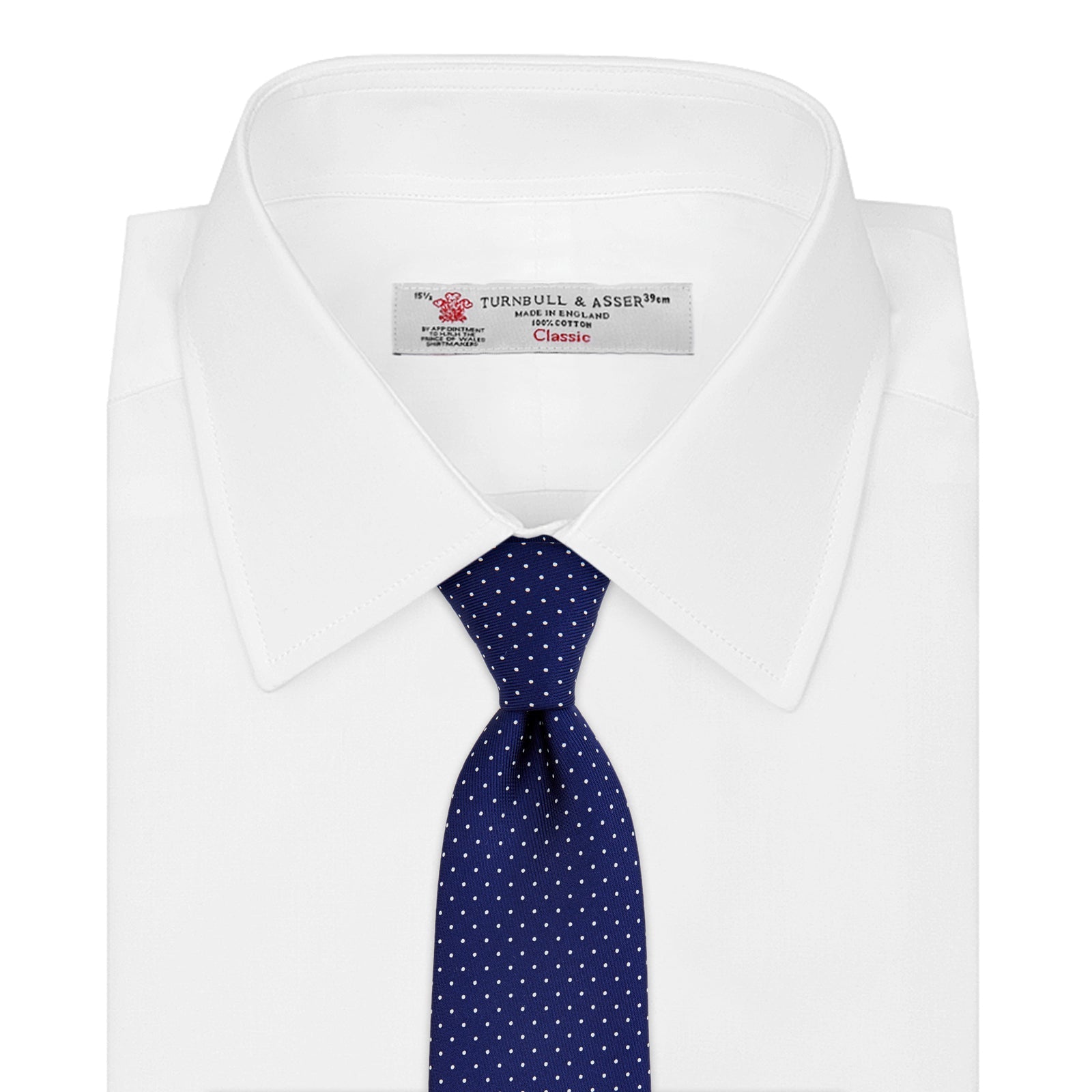View 2 of product The Blue and White Small Spot Printed Silk Tie by Turnbull & Asser, shown rolled on a white background, features a refined white polka dot pattern—ideal for complementing any office shirt.