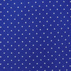 View 3 of product The Turnbull & Asser Slim Royal Blue and White Small Spot Printed Silk Tie, featuring white polka dots, is ideal for office wear and shown rolled up on a plain white background.