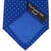 View 4 of product The Turnbull & Asser Royal Blue and White Small Spot Printed Silk Tie, shown rolled on a white background, features a refined spot pattern—ideal for complementing your office shirt.