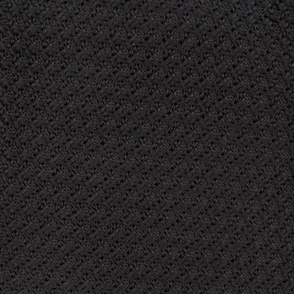 The Turnbull & Asser Black Grenadine Silk Tie features a refined textured look and dimensional stability thanks to its subtle grenadine weave, shown here on a white background.