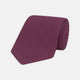 The Turnbull & Asser Wine Grenadine Silk Tie, featuring a textured weave in dark purple, is displayed rolled-up on a plain white background.