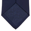 View 4 of product The Turnbull & Asser Navy Horizontal Twill Silk Tie features a subtle textured pattern and is elegantly displayed on a plain white background—ideal for pairing with cotton shirts for a smart, refined look.