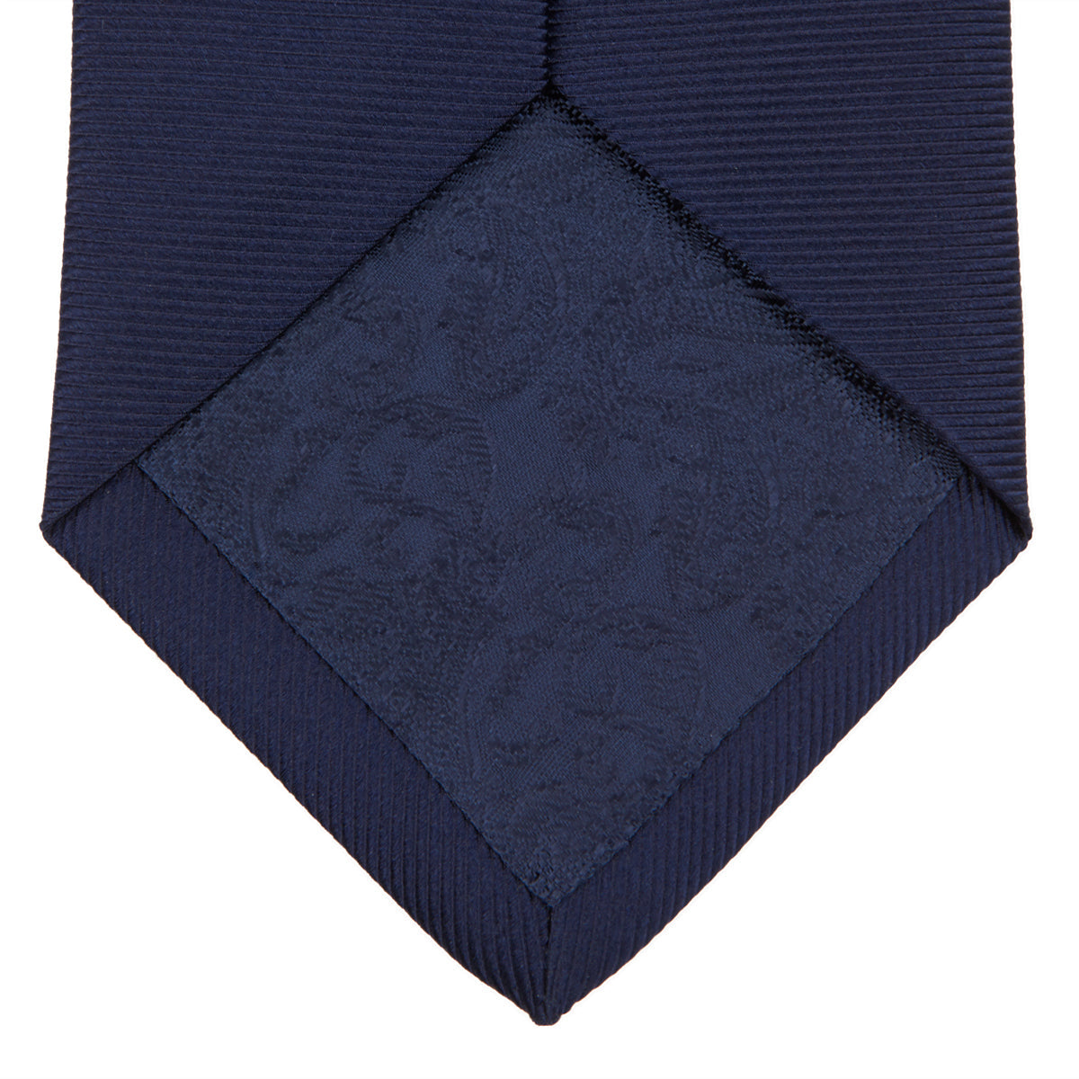 View 4 of product The Turnbull & Asser Navy Horizontal Twill Silk Tie features a subtle textured pattern and is elegantly displayed on a plain white background—ideal for pairing with cotton shirts for a smart, refined look.
