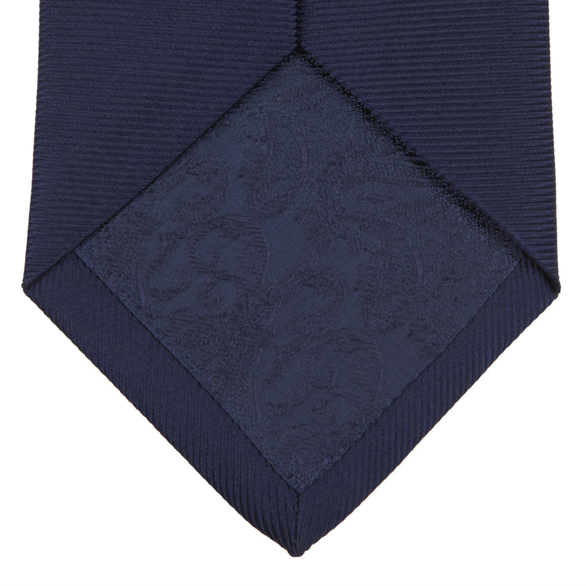 View 3 of product The Slim Navy Twill Silk Tie by Turnbull & Asser features a classic textured design—perfect with a cotton shirt—neatly displayed on a white background.