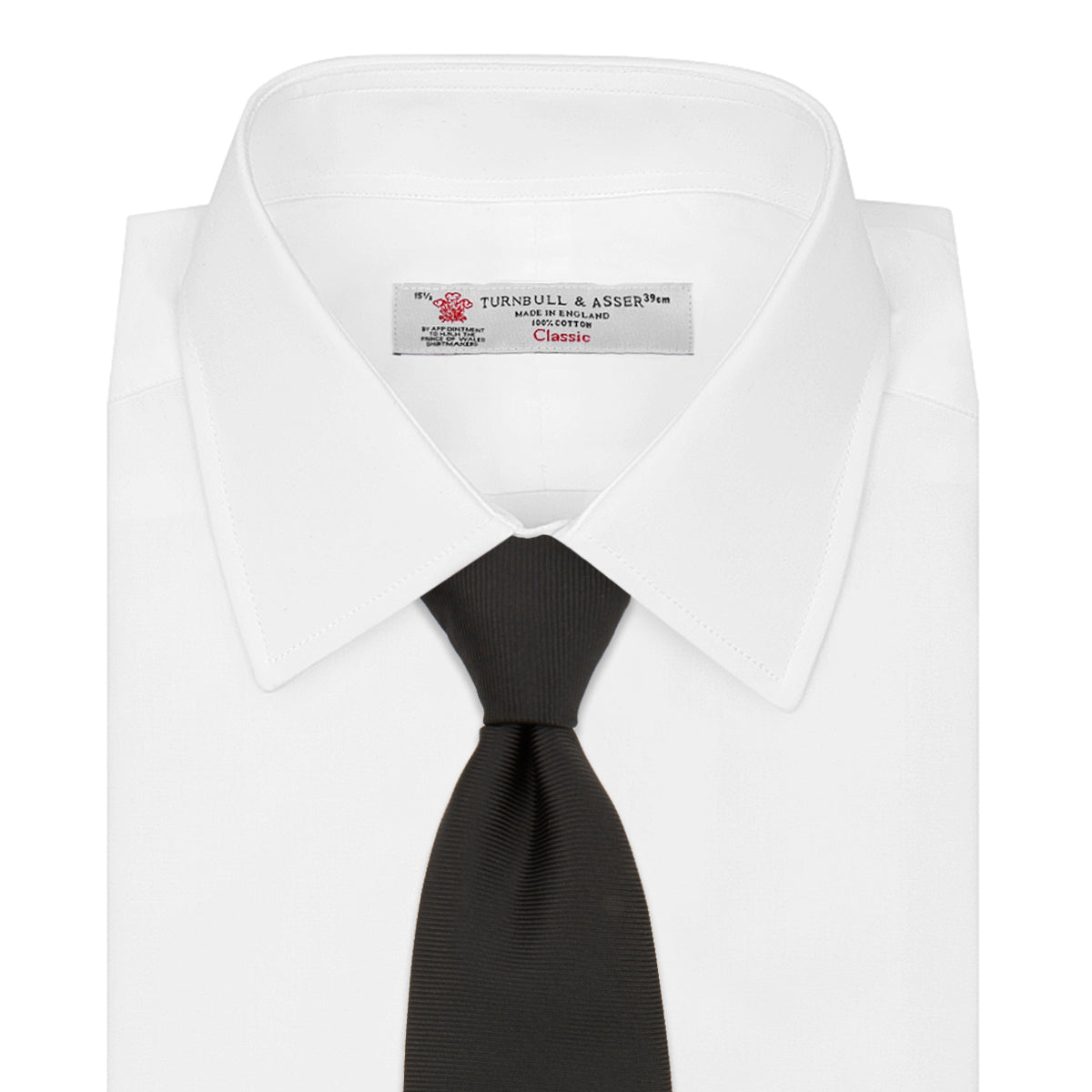 View 2 of product The Turnbull & Asser Black Twill Silk Tie features a subtle textured pattern and is displayed neatly rolled on a plain white background.