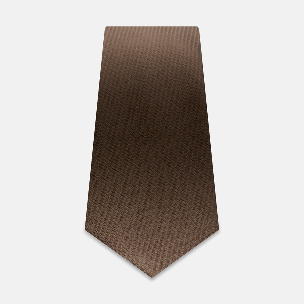 The Turnbull & Asser Brown Lace Silk Tie, featuring a subtle houndstooth pattern, is shown flat against a light gray background.