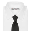 View 2 of product A Long Black Herringbone Silk Tie by Turnbull & Asser is shown rolled up on a plain white background.