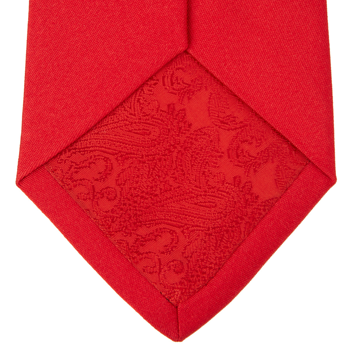 View 4 of product A Red Plain Satin Silk Tie by Turnbull & Asser is neatly rolled and displayed against a plain light gray background.