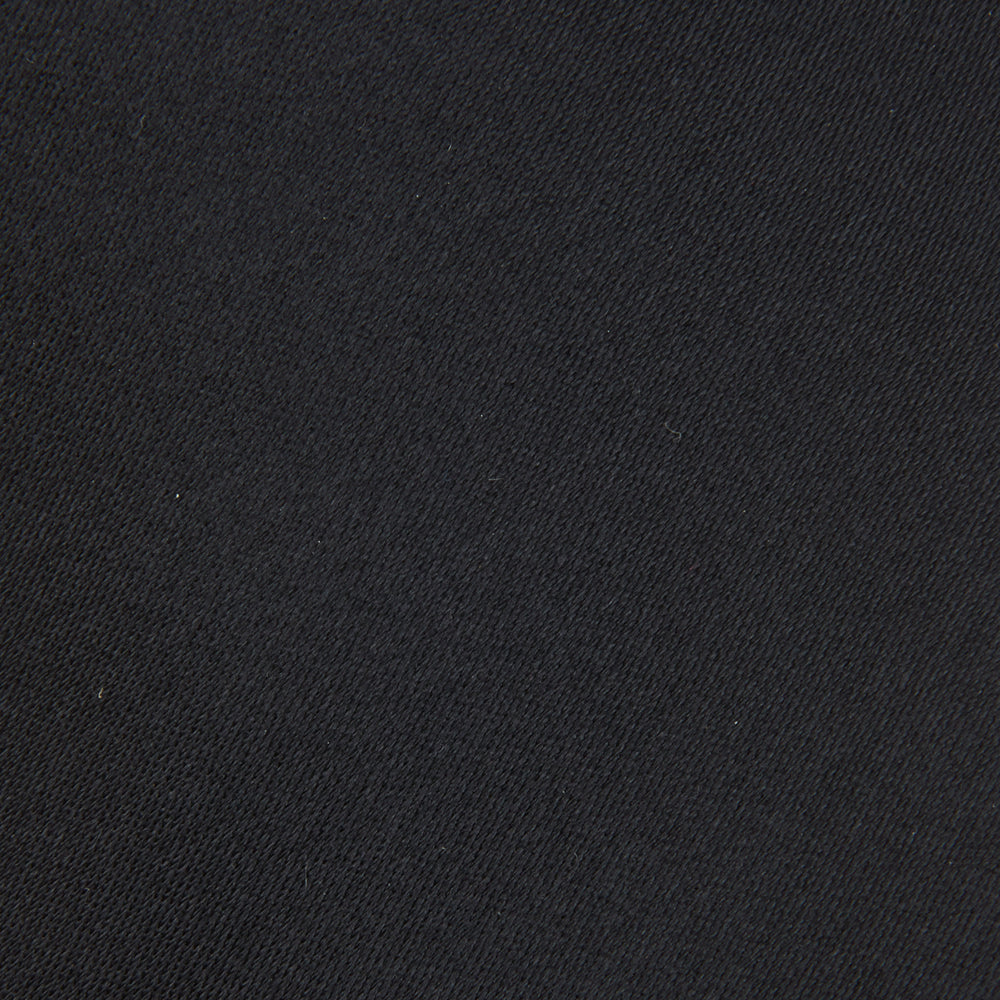 The Turnbull & Asser Black Plain Satin Silk Tie, neatly rolled and shown on a white background, adds versatile elegance to any formal outfit.