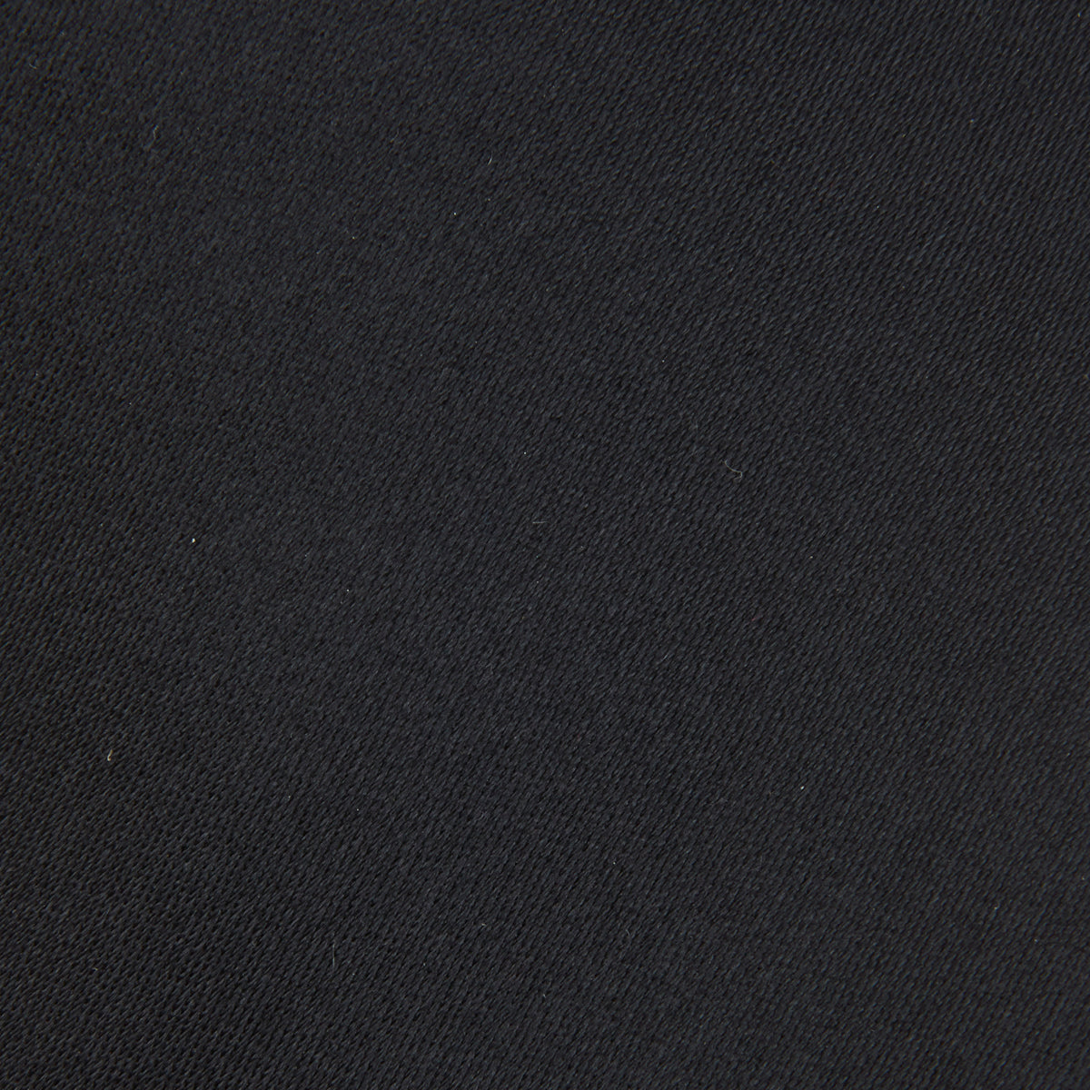 View 3 of product The Turnbull & Asser Black Plain Satin Silk Tie, neatly rolled and shown on a white background, adds versatile elegance to any formal outfit.