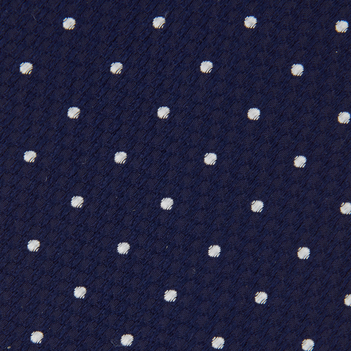 View 3 of product The Turnbull & Asser Navy and White Spot Lace Silk Tie features evenly spaced small white polka dots—perfect for adding a classic touch to any office shirt.