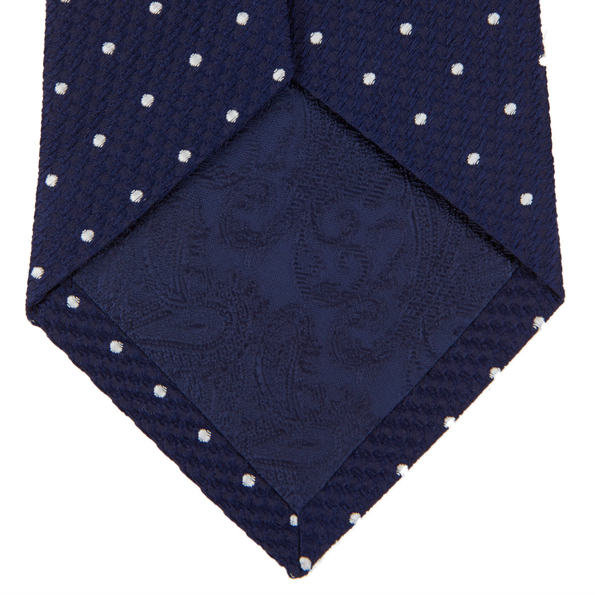 View 4 of product The Turnbull & Asser Navy and White Spot Lace Silk Tie features evenly spaced small white polka dots—perfect for adding a classic touch to any office shirt.