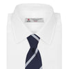 View 2 of product Turnbull & Asser’s Slim Navy and White Blazer Stripe Repp Silk Tie features two white diagonal stripes, rolled neatly on a white background—an ideal accessory to complement any office shirt.