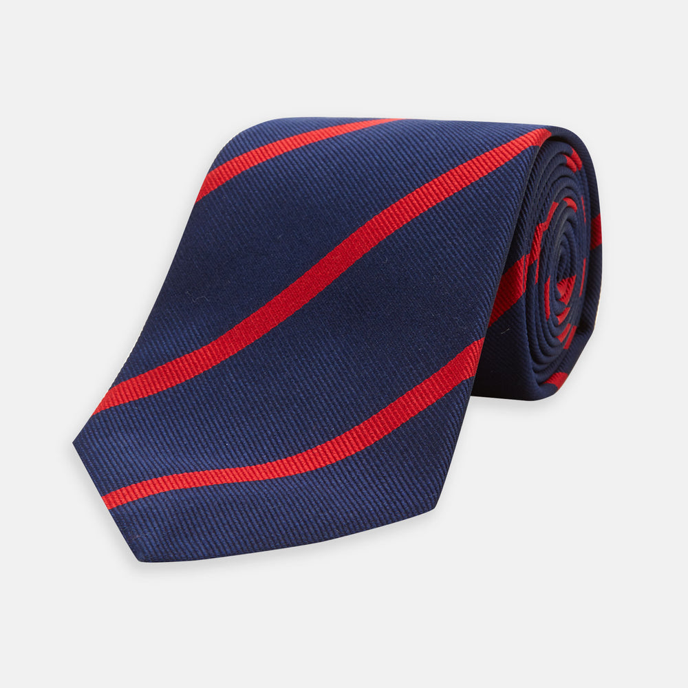 The Navy and Red Blazer Stripe Repp Silk Tie by Turnbull & Asser is a classic accessory, ideal for a timeless schoolboy look or to complement any sharp office shirt.