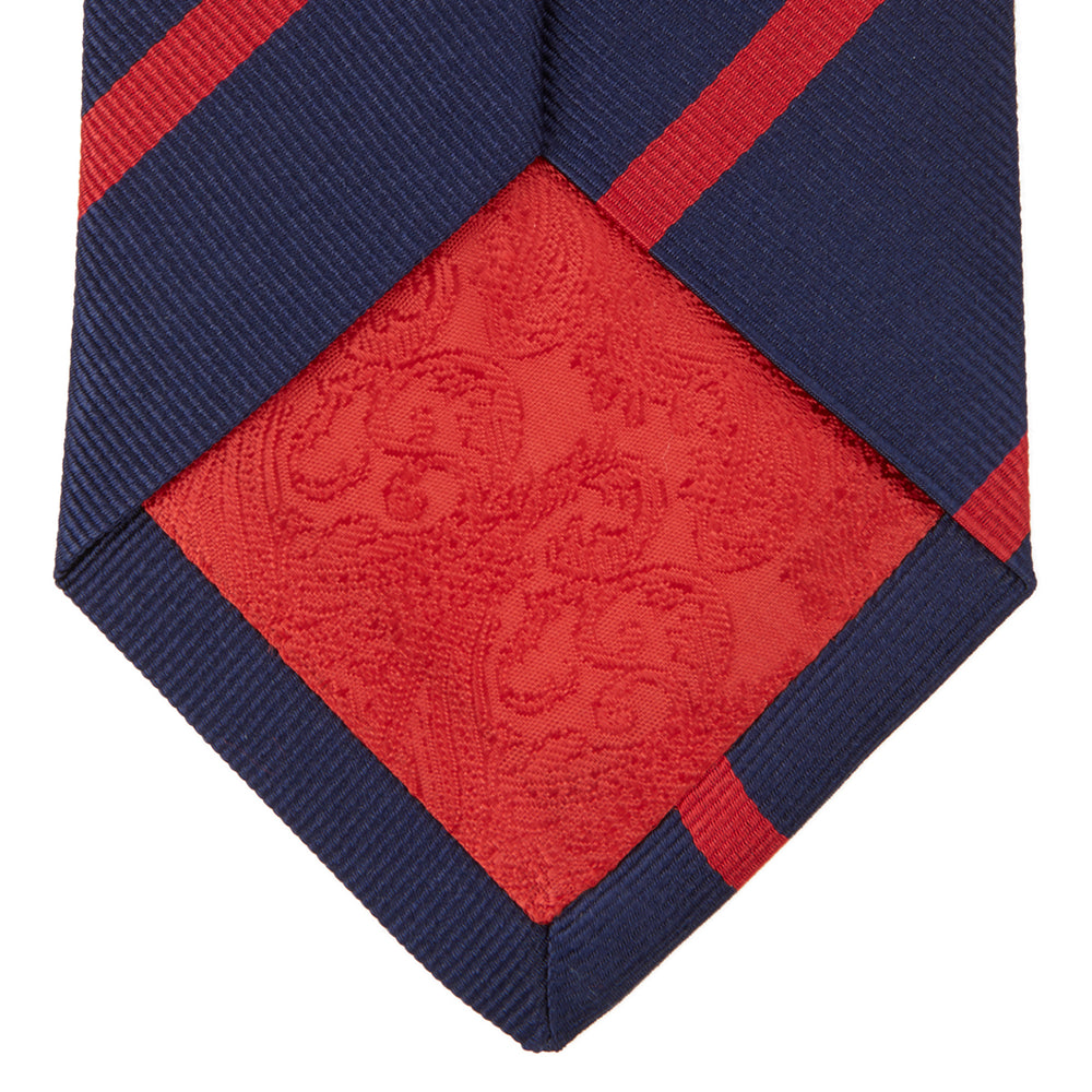 The Navy and Red Blazer Stripe Repp Silk Tie by Turnbull & Asser is a classic accessory, ideal for a timeless schoolboy look or to complement any sharp office shirt.