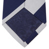 View 4 of product The Turnbull & Asser Navy and Off-White Block Stripe Repp Silk Tie features wide diagonal stripes, ideal for pairing with an office shirt against a plain light background.
