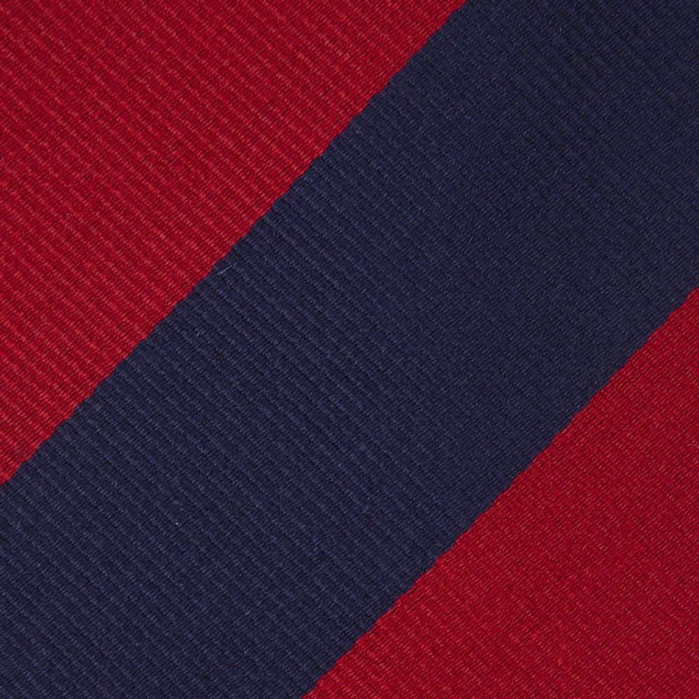 The Turnbull & Asser Long Navy and Red Block Stripe Repp Silk Tie features bold diagonal stripes on white—an ideal office shirt companion.