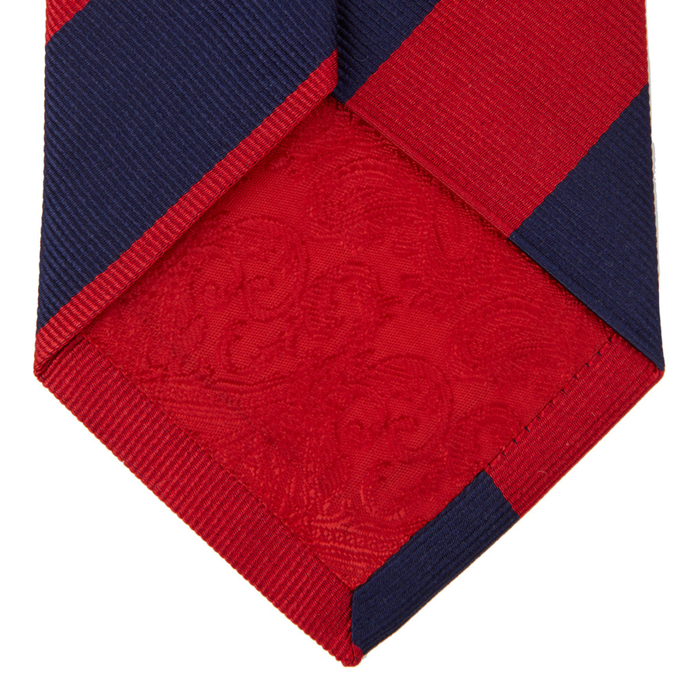 The Navy and Red Block Stripe Repp Silk Tie by Turnbull & Asser features bold diagonal red and navy stripes on a crisp white background.