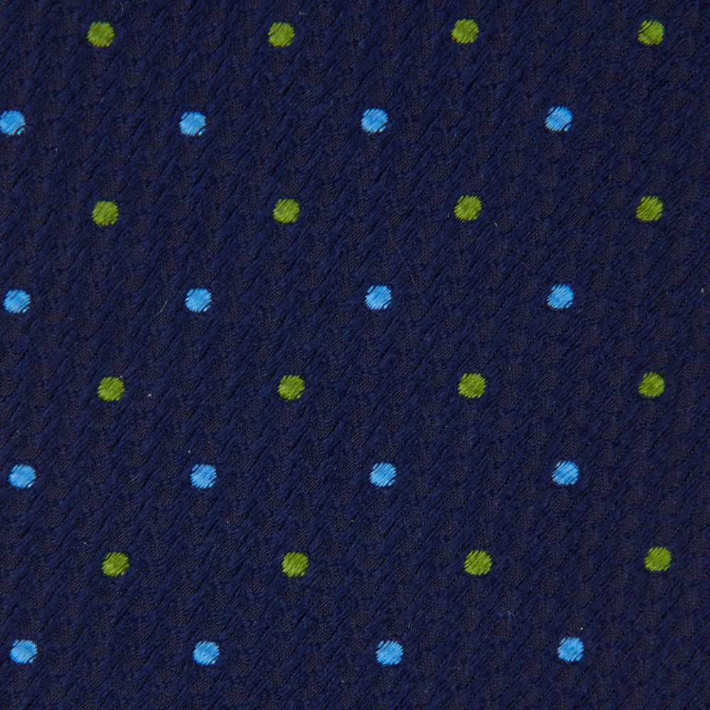 The Turnbull & Asser Navy, Blue & Green Spot Lace Silk Tie features small, evenly spaced blue and green spots—perfect for adding a refined touch to your favorite office shirt.