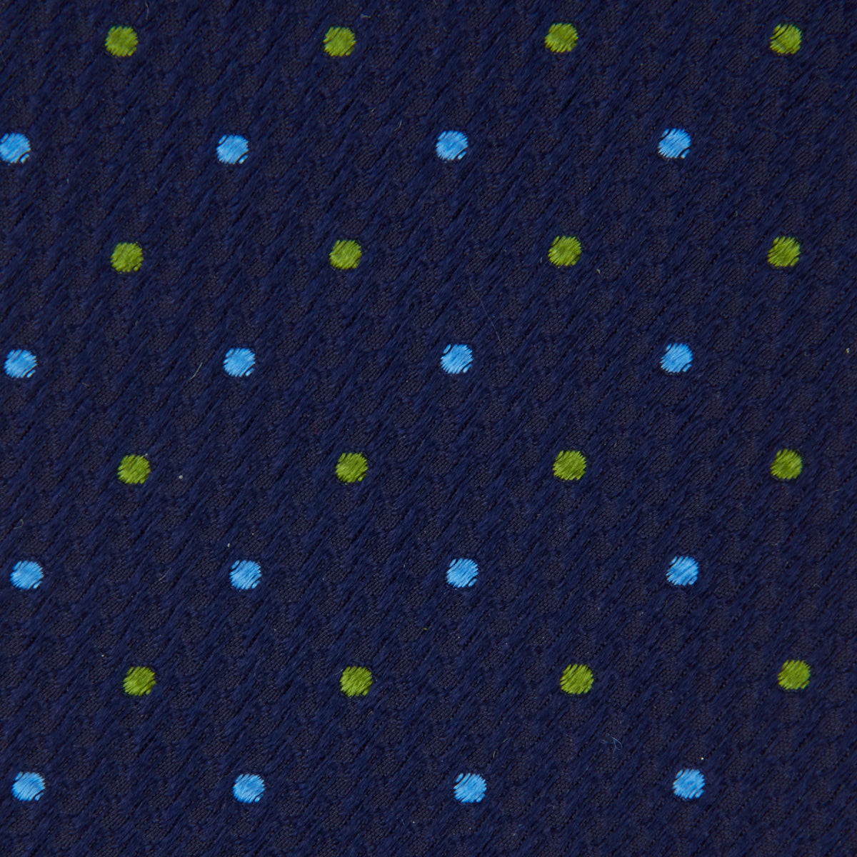 View 3 of product The Turnbull & Asser Navy, Blue & Green Spot Lace Silk Tie features small, evenly spaced blue and green spots—perfect for adding a refined touch to your favorite office shirt.