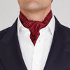 View 2 of product The Burgundy and White Mini Spot Silk Cravat by Turnbull & Asser adds refined detail—ideal neckwear for wedding guests, especially paired with a matching maroon pocket square.