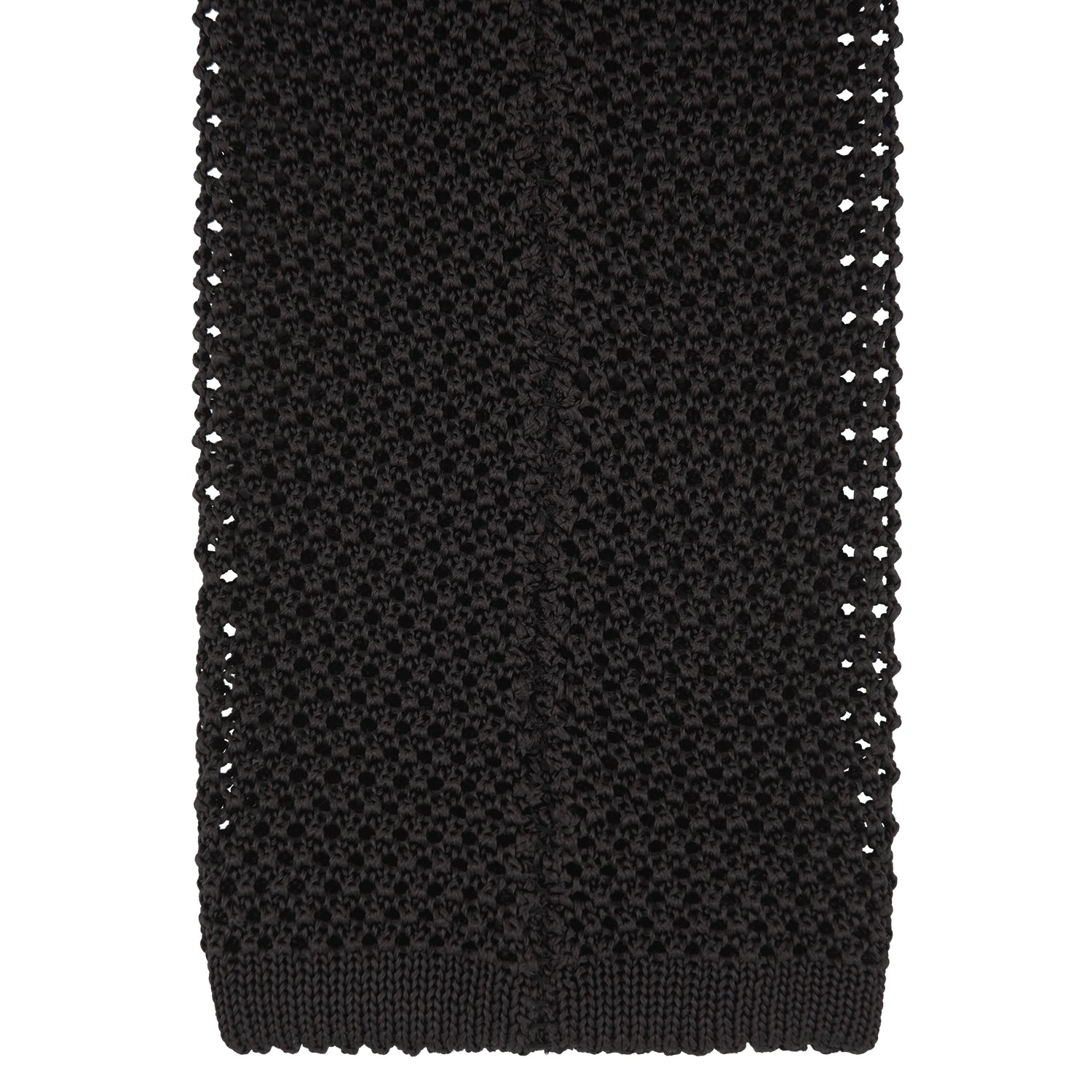View 4 of product The Turnbull & Asser Black Knitted Silk Tie features a textured pattern and is displayed rolled up on a white background—a stylish, versatile accessory perfect for elevating any gentleman's wardrobe.