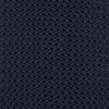 View 3 of product The Turnbull & Asser Navy Knitted Silk Tie features a textured open weave and flat squared ends, making it a versatile accessory for the modern gentleman’s wardrobe. Shown rolled up on a plain white background.