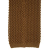 View 4 of product The Gold Knitted Silk Tie by Turnbull & Asser, featuring a textured pattern, is elegantly displayed on a plain white background.