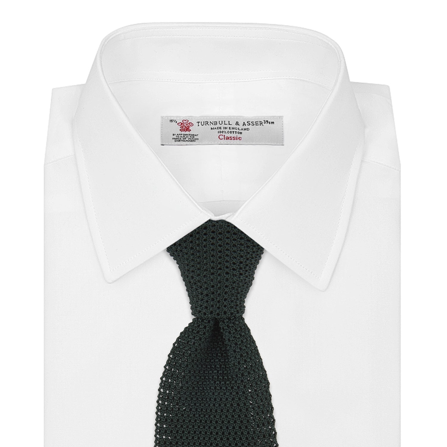 View 2 of product The Turnbull & Asser Green Knitted Silk Tie features a rich dark green hue and textured weave, making it an elegant accessory for any gentleman's wardrobe, shown rolled up against a light background.