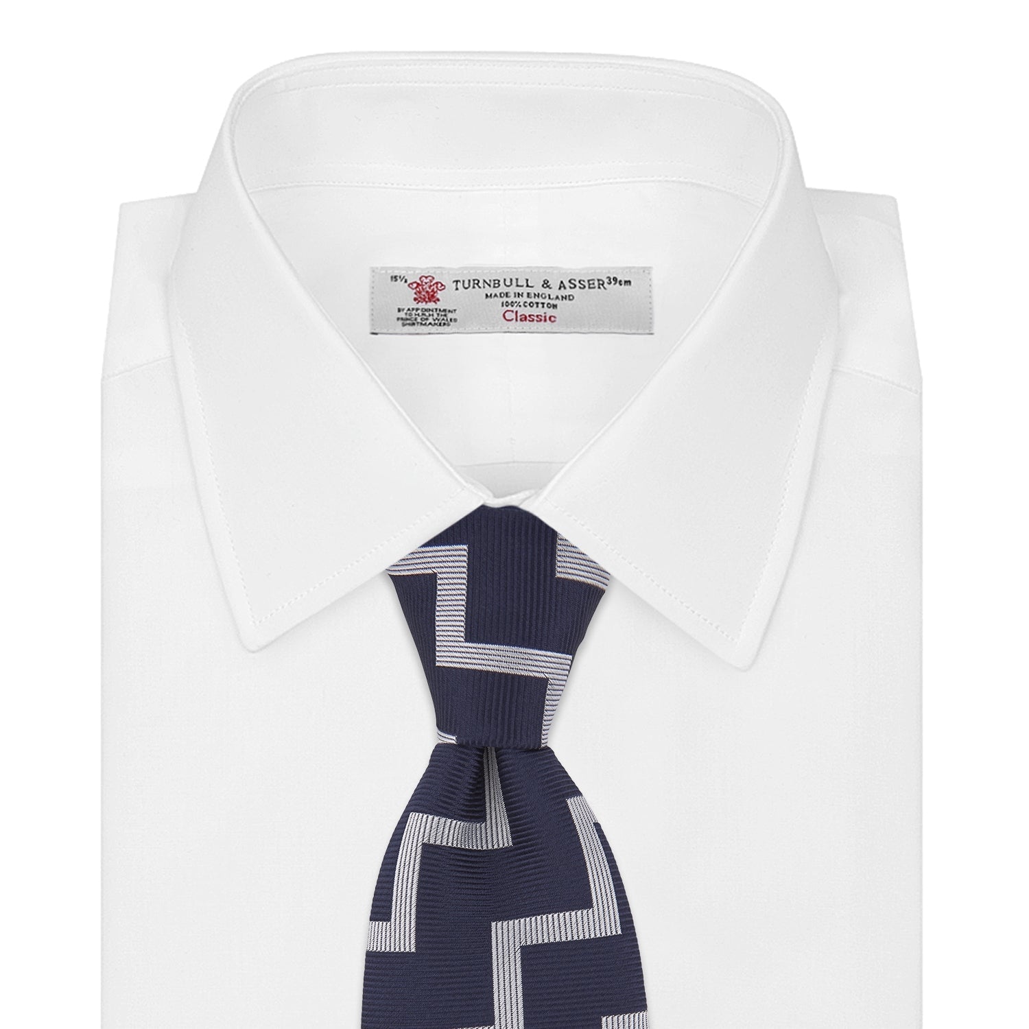View 2 of product The Navy and White Striped Zigzag Silk Tie by Turnbull & Asser, shown rolled on a white background, features bold zigzag stripes—an ideal accessory for the modern gentleman’s everyday style.