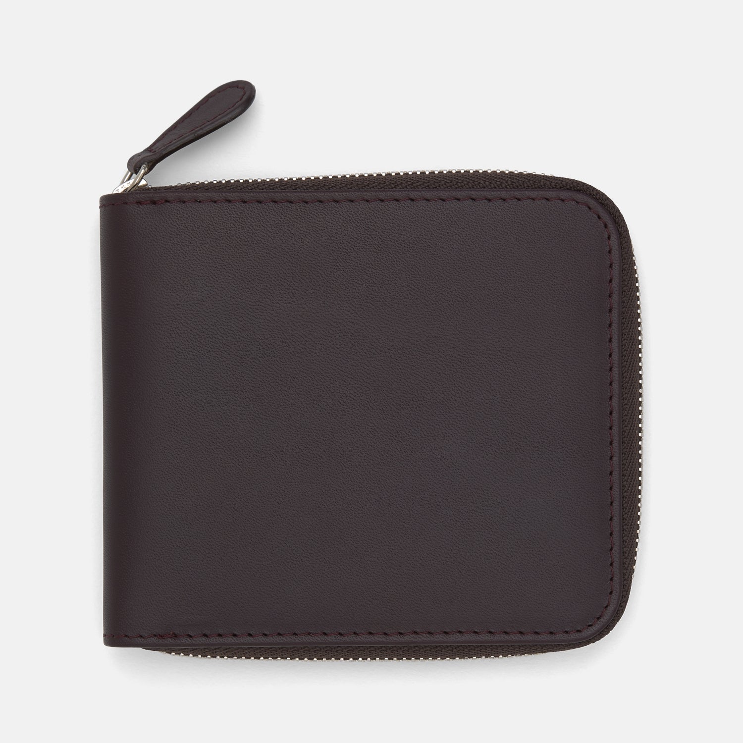 View 1 of product The Turnbull & Asser Violla Leather 8 C/C Zipped Wallet, in dark brown leather with a zipper along the top and side, sits on a plain light background.