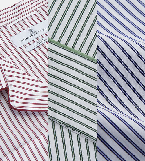 Close-up of three striped shirt fabrics: red stripes on the left, green stripes in the center, and blue stripes on the right, each with different patterns and stitching.