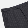View 2 of product The Charcoal Pinstripe Henry Trousers by Turnbull & Asser feature white vertical stripes, a button and zip closure, belt loops, and side pockets, shown against a plain white background.
