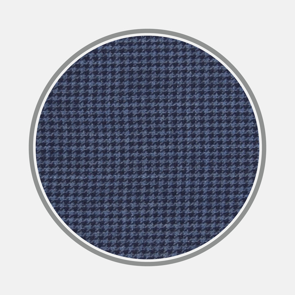 A circular swatch of Turnbull & Asser's Navy Check Flannel Fabric features a small repeating houndstooth pattern in navy blue, set on a white background with a thin gray border.