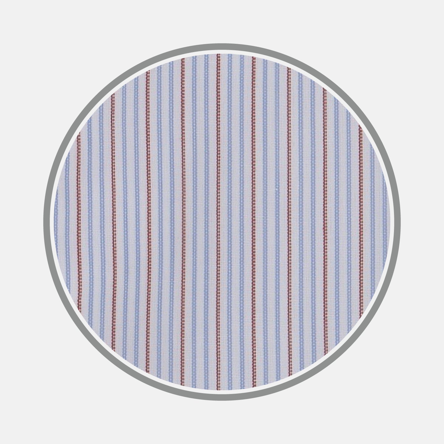 View 1 of product A close-up of Turnbull & Asser's Red and Navy Supraluxe Stripe Fabric, showing vertical blue, white, and red stripes within a circular frame on a plain light background.