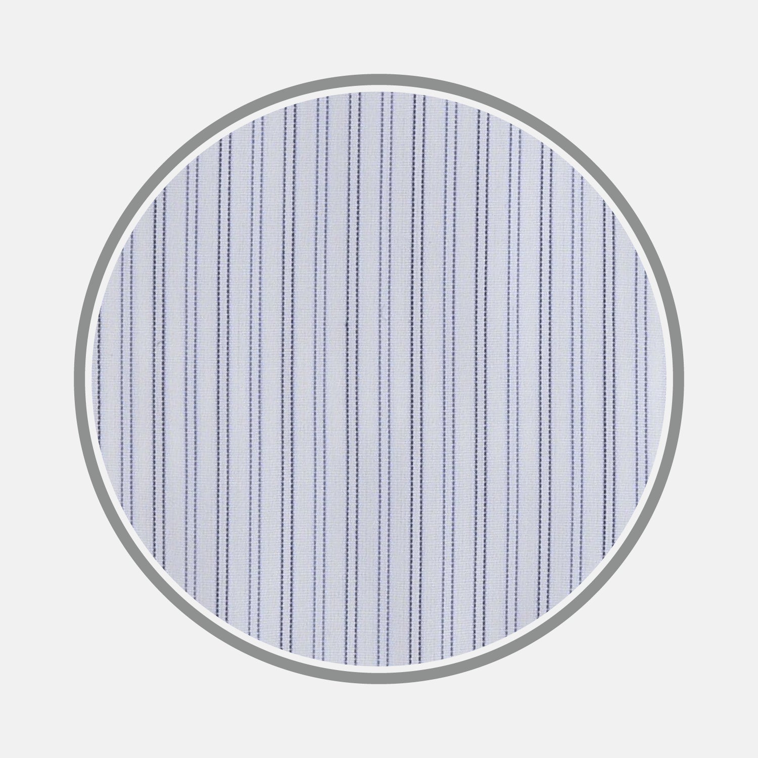 View 1 of product A close-up of Light Blue Double Stripe Sea Island Quality Cotton Fabric by Turnbull & Asser, showing thin vertical stripes within a circular frame on a plain background.