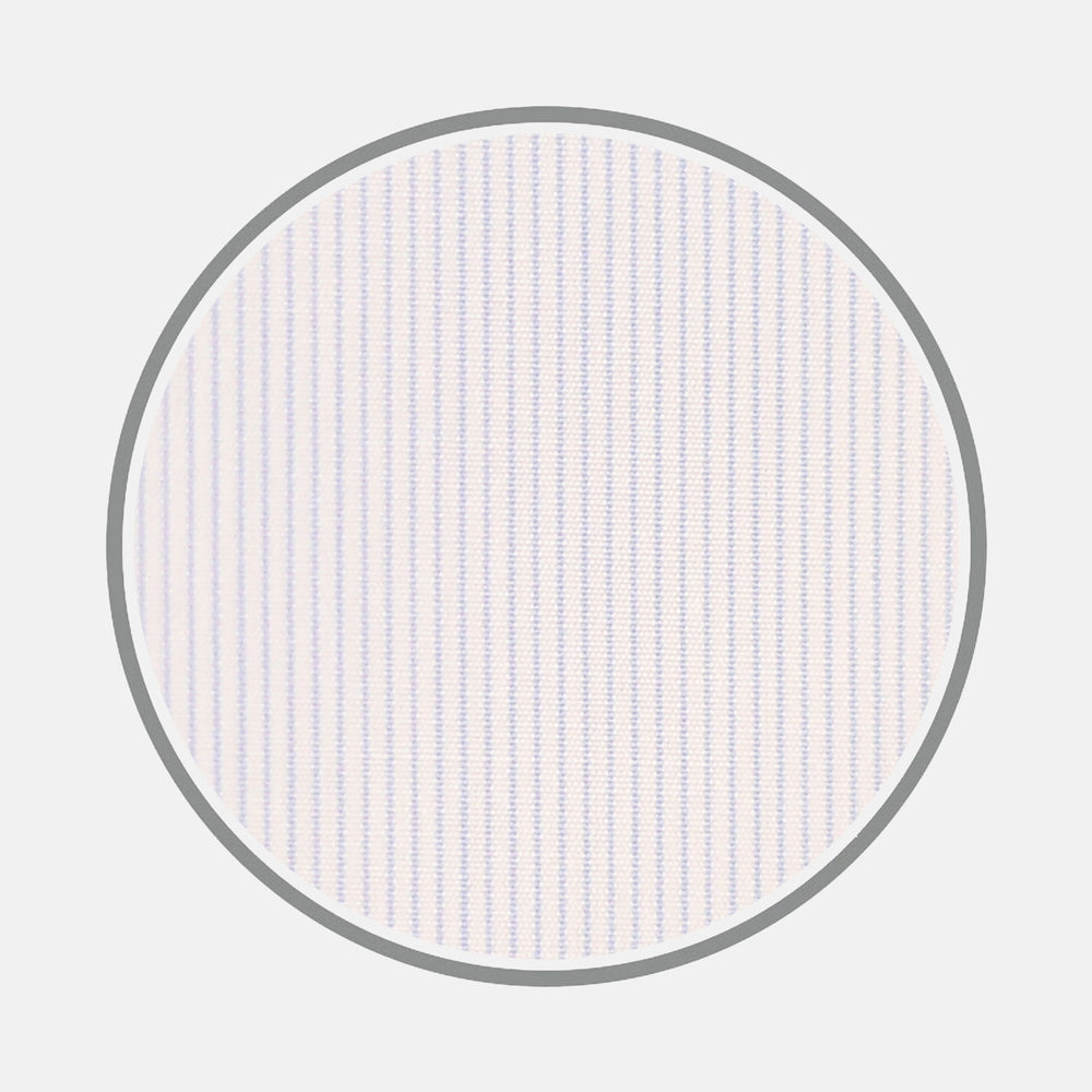 Close-up of Turnbull & Asser Light Blue Hairline Stripe Cotton Fabric featuring fine, evenly spaced vertical blue stripes on a white background, displayed in a gray circular frame.